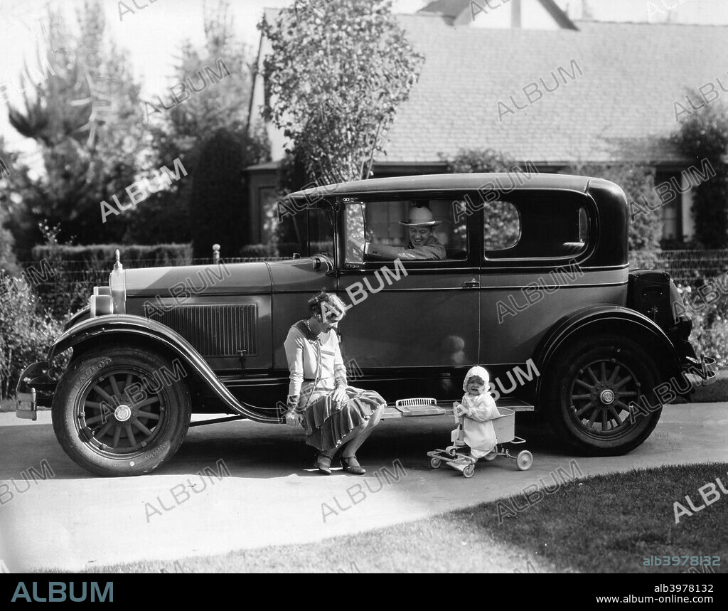 Stan Laurel at the wheel of 1927 Hupmobile with his wife Lois and daughter Lois.