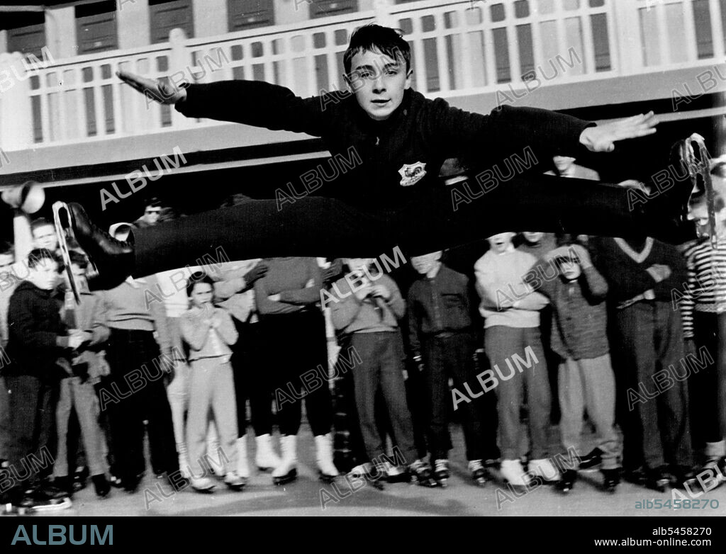 French boy Alain Giletti, who holds the European skating championship, gives an exhibition of his skill in exhibition for some other schoolchildren at Paris. March 26, 1955.