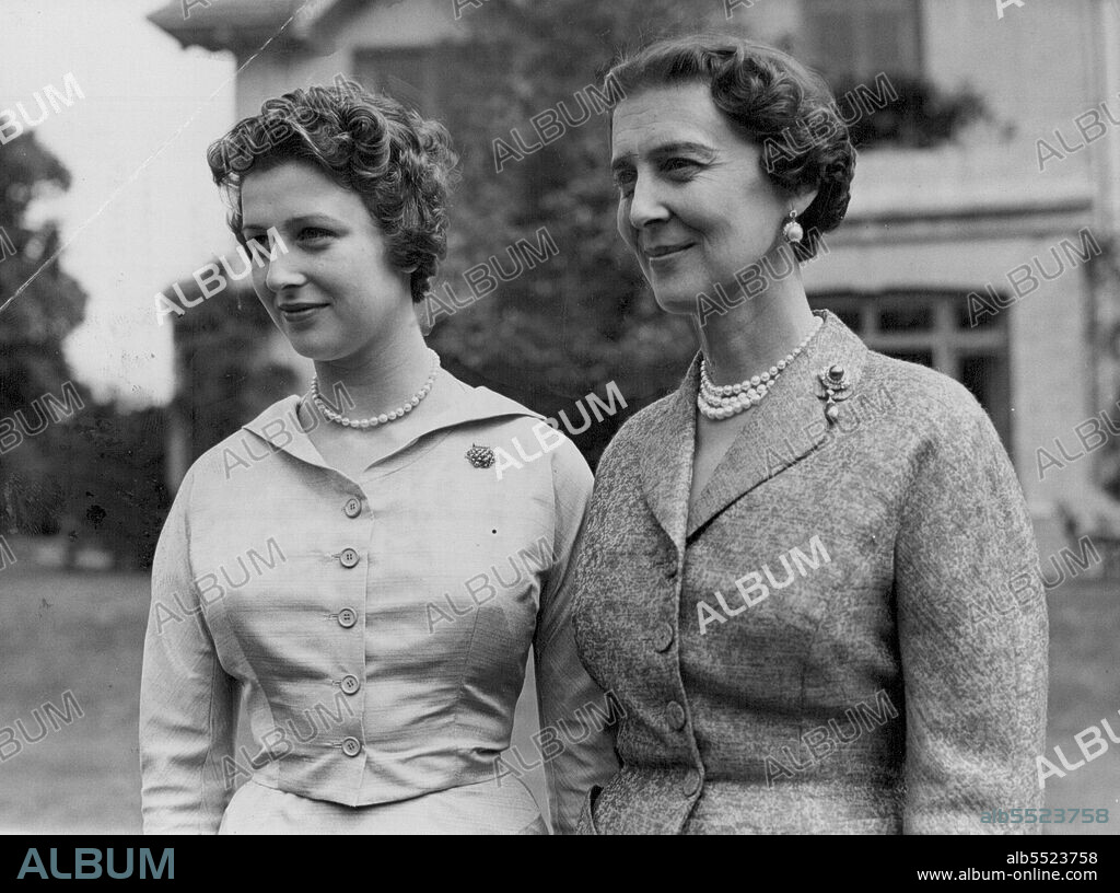 At Home to Photographers -- Princess Alexandra with her mother, The Duchess of Kent, in the grounds of the Buckinghamshire home today.Princess Alexandra, 17, daughter of The Duchess of Kent, was officially "At Home" to photographers today.With her mother, the princess posed for a number of cameramen in the grounds of the coppins, in Iver, Buckinghamshire.The Princess made her debut in public life this summer and has carried out a number of social and official engagements, alone, of with her mother. July 09, 1954. (Photo by Paul Popper, Paul Popper Ltd.).