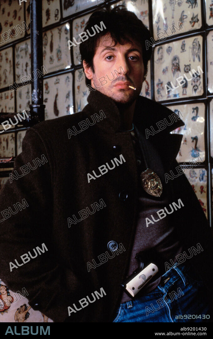 SYLVESTER STALLONE in COBRA, 1986, directed by GEORGE P. COSMATOS. Copyright WARNER BROTHERS.