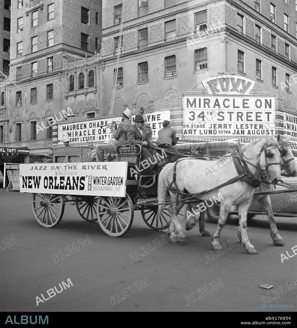 WILLIAM PAUL GOTTLIEB. Portrait of Kaiser Marshall, Art Hodes, Sandy Williams, Cecil (Xavier) Scott, and Henry (Clay) Goodwin, Times Square, New York, N.Y., ca. July 1947.
