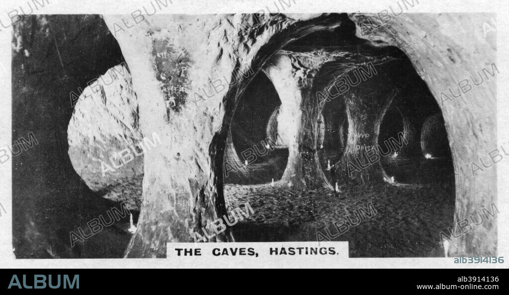 'The Caves, Hastings', Sussex, c1920s. St Clements Caves became a tourist attraction in the 1860s. Cigarette card produced by the Westminster Tobacco Co Ltd, The second series of British royal and ancient buildings.