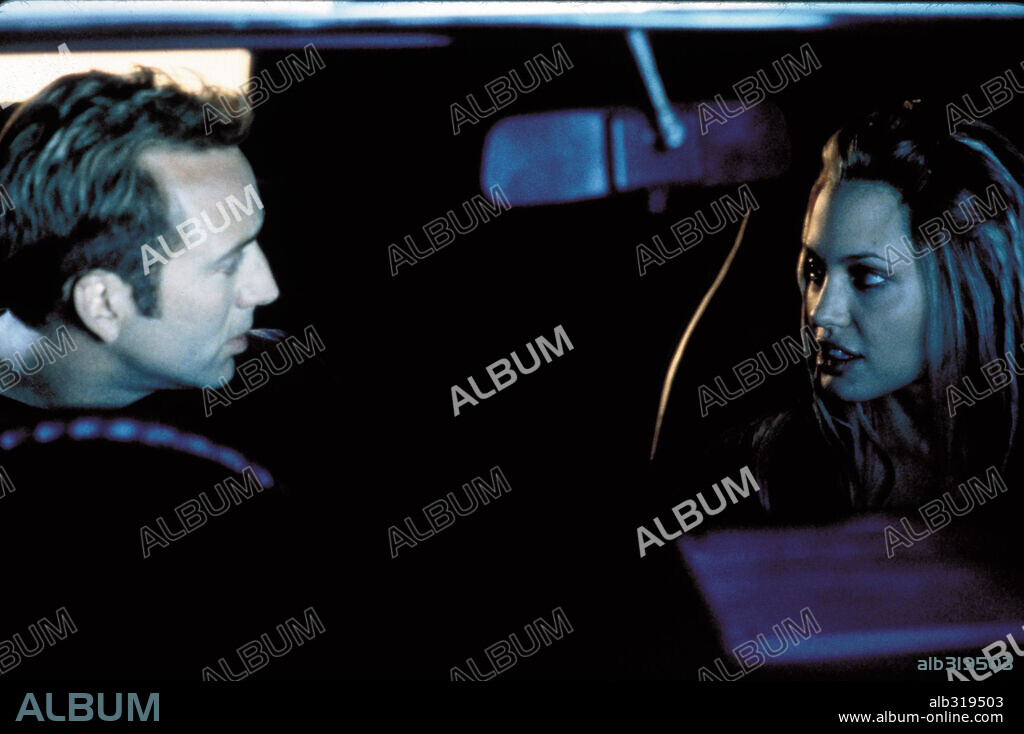 ANGELINA JOLIE and NICOLAS CAGE in GONE IN 60 SECONDS, 2000, directed by DOMINIC SENA. Copyright TOUCHSTONE PICTURES / MORTON, MERRICK.