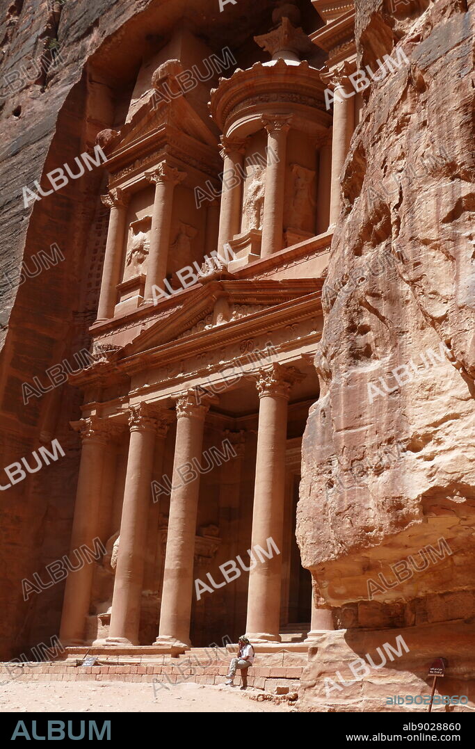 Al-Khazneh (The Treasury) a temple in the ancient Nabatean Kingdom city of Petra, Jordan. The structure was carved out of a sandstone rock face and is believed to have been the mausoleum of the Nabatean King Aretas IV in the 1st century AD. It is one of the most popular tourist attractions in both Jordan and the region. In 1812, the city of Petra and Al-Khazneh was rediscovered by Swiss explorer Johann Ludwig Burckhardt.