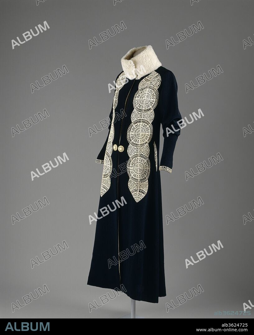 Coat. Culture: French. Designer: Paul Poiret (French, Paris 1879-1944 Paris). Date: ca. 1919.
In the 1910s, Poiret introduced an avant-garde sensibility into couture.  His penchant for opulent gestures, lush fabrics, fur, and feathers was part of his grandiose "Gesamtkunstwerk," inspired by stage and orientalist extravaganza.  He was also capable of more subdued garments.  In the case of this day coat, the leather of the appliqués is cut into delicate filigree and couched by hand onto the wool to create a graphic lattice of white over black.  The cylindrical silhouette and standing collar suggest inspiration from Chinese or Near Eastern robes and coats.