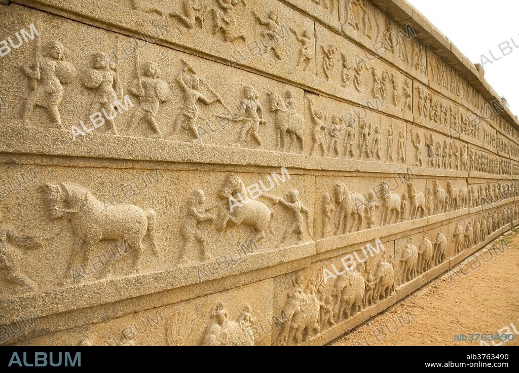 Bas relief scenes from life in the Vijayanagar Empire on the Mahanavami Dibba within the royal enclosure at Hampi, UNESCO World Heritage Site, Karnataka, India, Asia.