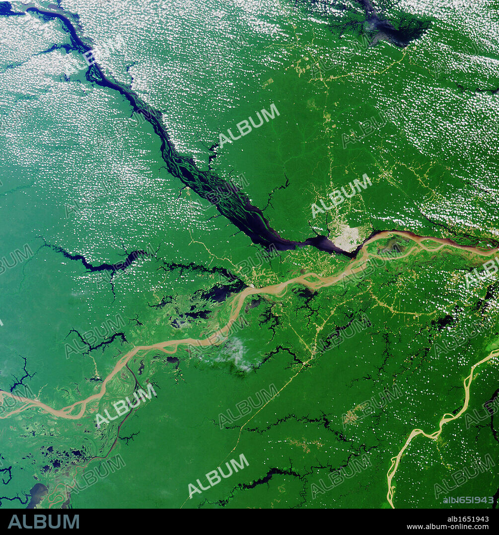 Convergence of the Rio Solimoes and the Rio Negro close to Manaus, Brazil, to form the River Amazon River, the greatest river on Earth. Satellite image 23 July 2000. Credit: NASA. Geography.