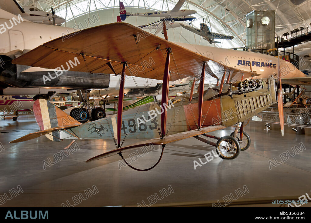 CURTISS AEROPLANE AND MOTOR COMPANY. Single-engine, two-seat, U.S.-built World War I trainer aircraft; 90-horsepower Curtiss OX-5 engine. Tan wings, brown and blue fuselage. The Curtiss JN-4D is almost synonymous with American aviation in the 1920s. The Jenny, as it was affectionately called, appeared in 1917. Heretofore having only produced pusher aircraft, Glenn Curtiss hired an experienced European designer to lead the new project named B. Douglas Thomas, who had worked for Avro and Sopwith in England. The Jenny performed admirably as a trainer for the U.S. Air Service during World War I, but its more significant role in aviation history was as a barnstorming and mail-carrying airplane in the 1920s. Large numbers of relatively inexpensive war surplus Jennys were available in the United States after 1918. Its affordability, ease of operation, and versatility made the Jenny the signature airplane of the barnstorming era. The Smithsonian acquired this Jenny in 1918 directly from the U.S. War Department. It is one of the finest remaining examples of this truly classic airplane.