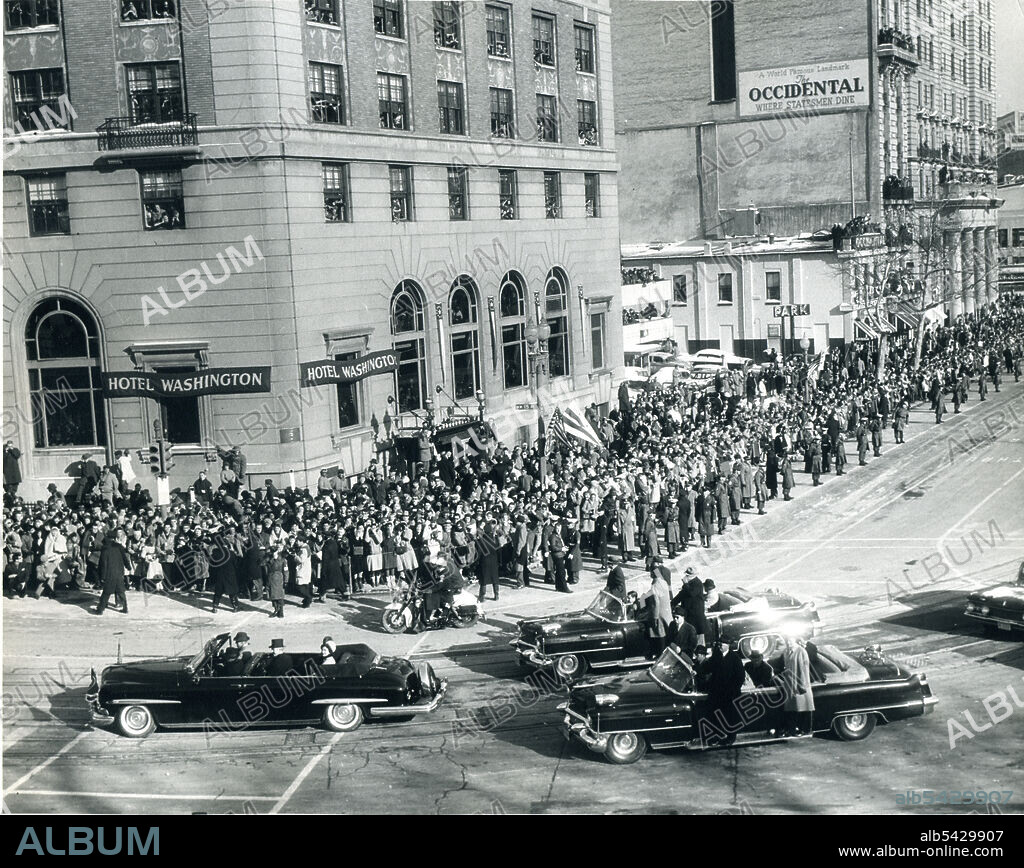 President John F. Kennedy and wife Jacqueline (in light-colored hat) ride in an open limosine during the Inaugural Parade on January 20, 1961. Abbie Rowe photographer.