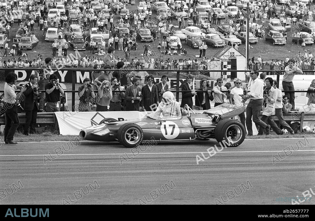Jack Brabham climbs from his Brabham-Cosworth BT33 in disgust, run out of fuel and lost race to Rindt's Lotus in last corner of last lap, finished 2nd. British GP, Brands Hatch, England 1970.
