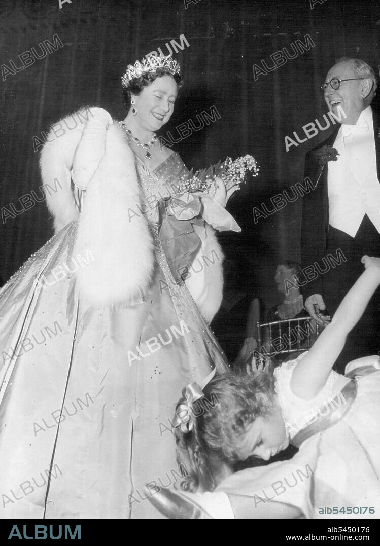 Warm Welcome -- Queen Elizabeth the Queen Mother enjoys the enthusiasm of four-year-old Francesca Wynne-Roberts curry on her Majesty's arrival to open the Royal academy of dramatic art's new Theatre in London last Night December 2.The Queen Mother laid the foundation stone of the new Theatre named "The Vanbrugh" after Irene and violet Vanbrugh", Two years ago. The old Theatre was destroyed by a land mine in 1941. (Land Mine - A "bomb" floated down by Parachute).Francesca is the daughter of actress Joyce Redman.At right is Sir Kenneth Barnes, Principal of the R.A.D.A. December 03, 1953. (Photo by Associated Press Photo).