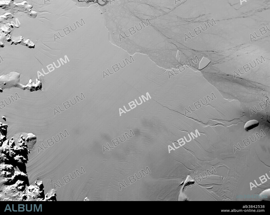 Between July 10 and 12, 2017, the Larsen C Ice Shelf in West Antarctica calved one of the largest icebergs in history. The rift in the ice shelf that spawned the trillion-ton iceberg remained relatively dormant until around 2012, when it was observed actively moving through a suture zone in the ice shelf. Suture zones are wide bands of ice that extend from glacier grounding lines (the boundary between a floating ice shelf and ice resting on bedrock) to the sea comprised of a frozen mixture of glacial ice and sea water, traditionally considered to be stabilizing features in ice shelves. This image of the ice shelf is from April 6, 2017. The rift can be seen at center.