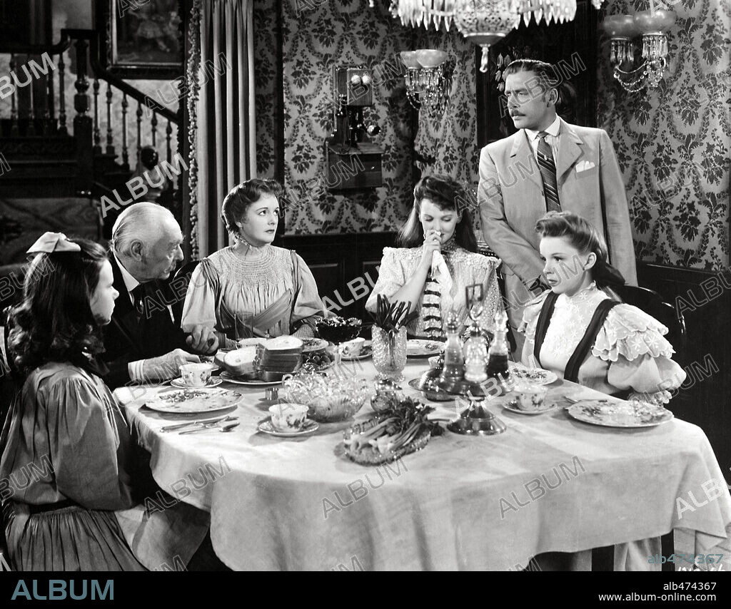 HARRY DAVENPORT, JUDY GARLAND, JUNE LOCKHART, LEON AMES, MARGARET O'BRIEN and MARY ASTOR in MEET ME IN ST. LOUIS, 1944, directed by VINCENTE MINNELLI. Copyright M.G.M.