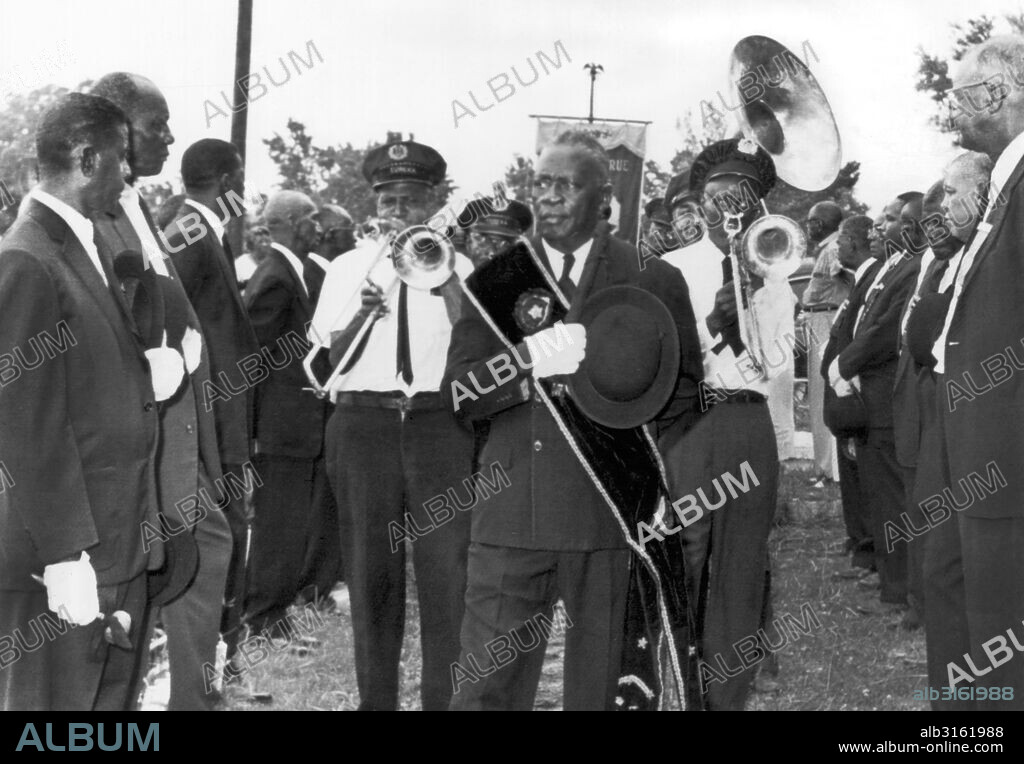 New Orleans, Louisiana: June 1, 1961. William "Baba" Ridgley, one of the last of the oldtime jazz musicians, is laid to rest in New Orleans to the accompaniment of a slow-shuffling jazz band of his former fellow players in the Eureka Jazz Band.