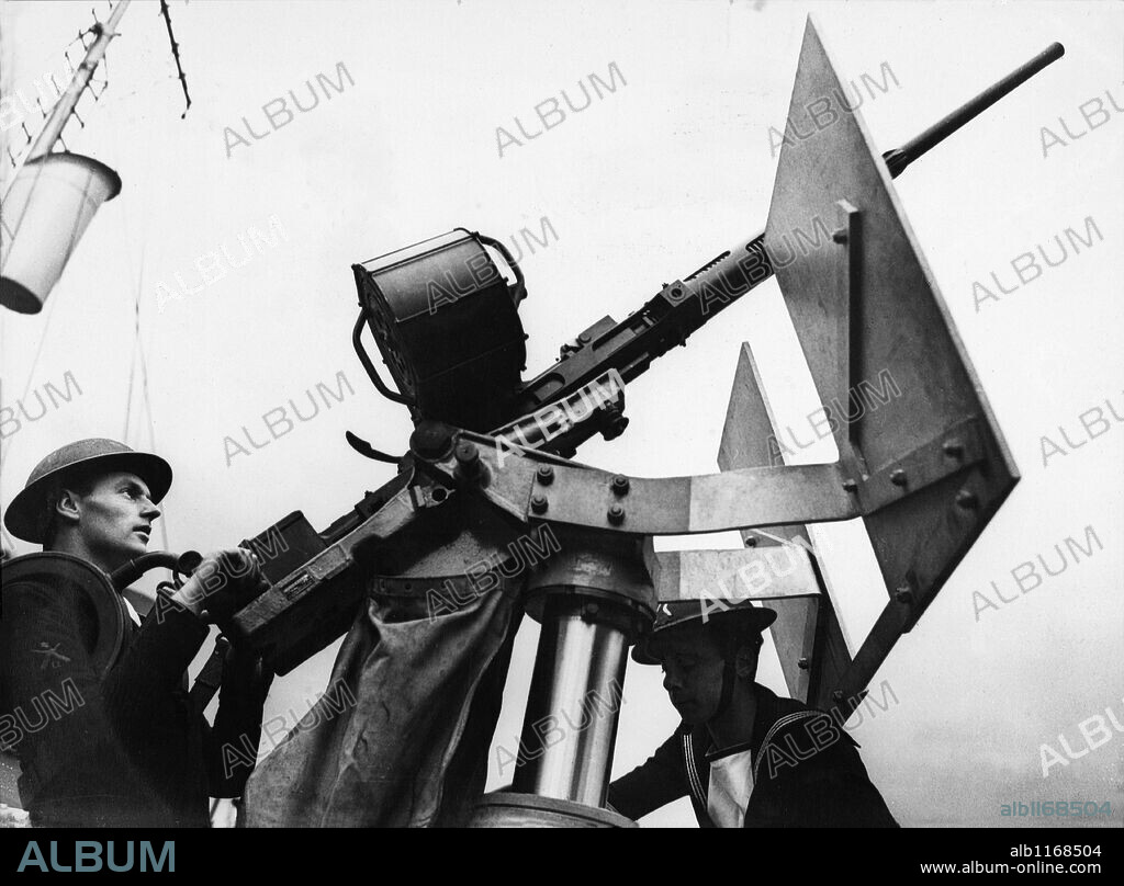 The Oerlikon anti-aircraft gun, one of the Navys deadliest A.A. weapons in action on board a British corvette. The Oerlikon has proved its woth in many encounters with the Luftwaffe.