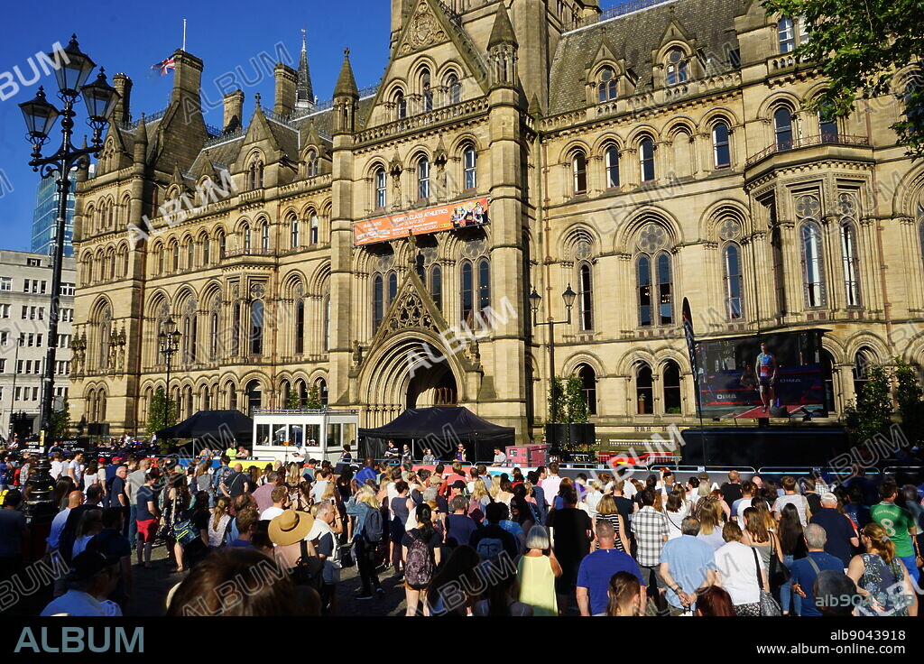 Vigil at Manchester Town Hall, during the days following the 22 May 2017, suicide bombing, carried out at Manchester Arena in Manchester, England, following a concert by American singer Ariana Grande.. The Town Hall is a Victorian, Neo-gothic municipal building in Manchester, England. It is the ceremonial headquarters of Manchester City Council It was designed by architect Alfred Waterhouse, the town hall was completed in 1877.