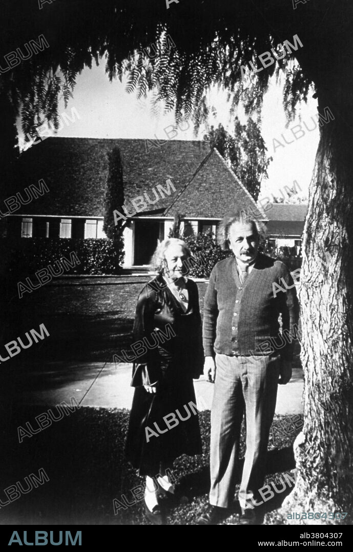 Einstein with his cousin and second wife Elsa Einstein Lowenthal, Caputh, Germany, circa 1930. Albert Einstein (March 14, 1879 - April 18, 1955) was a German-born theoretical physicist. He developed the general theory of relativity, one of the two pillars of modern physics. He is best known in popular culture for his mass-energy equivalence formula E = mc2. He received the 1921 Nobel Prize in Physics "for his services to Theoretical Physics, and especially for his discovery of the law of the photoelectric effect". He was visiting the US when Hitler came to power in 1933, and did not go back to Germany. He settled in America becoming a citizen in 1940. He helped alert President Roosevelt that Germany might be developing an atomic weapon, and recommended that the US begin similar research. He was in support of defending the Allied forces, but largely denounced using the discovery of nuclear fission as a weapon. Later, together with Bertrand Russell, Einstein signed the Russell-Einstein Manifesto, which highlighted the danger of nuclear weapons. Einstein was affiliated with the Institute for Advanced Study in Princeton until his death in 1955, at the age of 76. His great intelligence and originality have made the word Einstein synonymous with genius.
