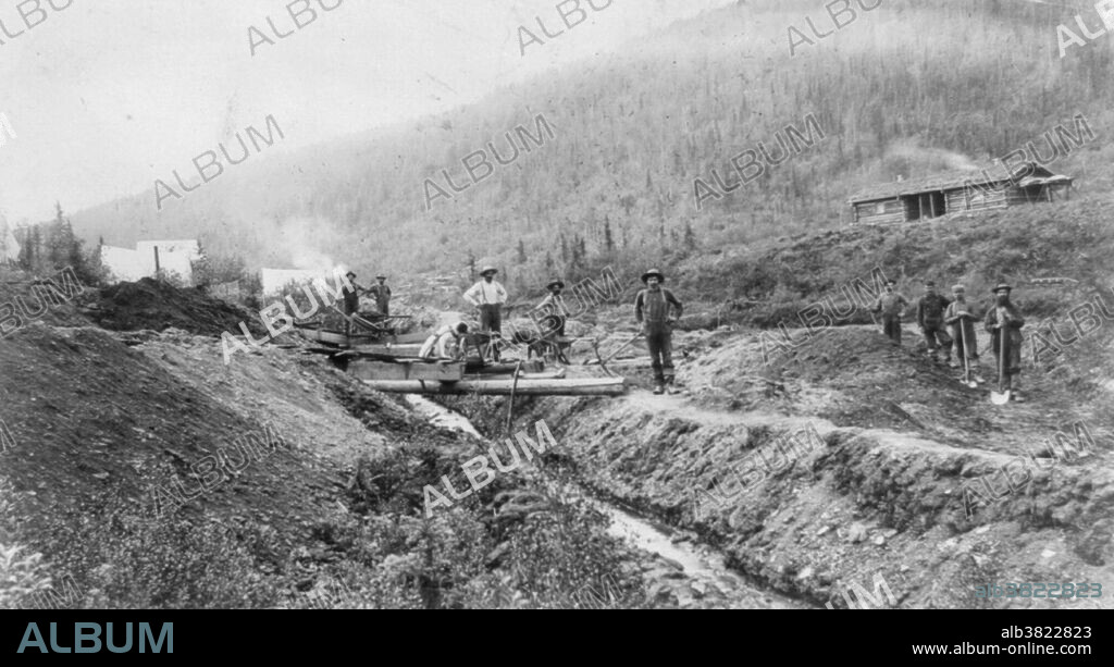 Gold miner's camp and large log cabin on hillside in El Dorado, California circa 1848-53. Prospectors with shovels and pick axe pose near ditch and flume. The California Gold Rush (1848-55) began on January 24, 1848, when gold was found by James Marshall at Sutter's Mill in Coloma, California. The news of gold brought some 300,000 people to California from the rest of the US and abroad. Half arrived by sea and half came from the east overland on the California Trail and the Gila River trail. The gold-seekers, called "forty-niners", often faced substantial hardships on the trip. At first, the gold nuggets could be picked up off the ground. Later, gold was recovered from streams and riverbeds using simple techniques, such as panning. More sophisticated methods were developed and later adopted elsewhere. At its peak, technological advances reached a point where significant financing was required, increasing the proportion of gold companies to individual miners. Gold worth tens of billions of today's dollars was recovered, which led to great wealth for a few. However, many returned home with little more than what they had started with.