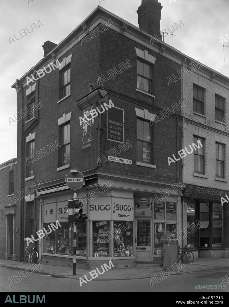 Sugg Sport shop, Grimsby, Lincolnshire, 1960.The Victoria Street branch of Sugg Sports in Grimsby. Frank Howe Sugg (1862-1933) was one of the few sportsmen to achieve a 'Derbyshire double', to have played at least one first team game for both Derbyshire County Cricket Club and Derby County Football Club. Well known throughout the sporting word, he later bacame an umpire after his playing career ended and formed Sugg Sports in 1888. The business was a great success and was a leading supplier of football, cricket and fishing equipment. The company continued trading until 2002.