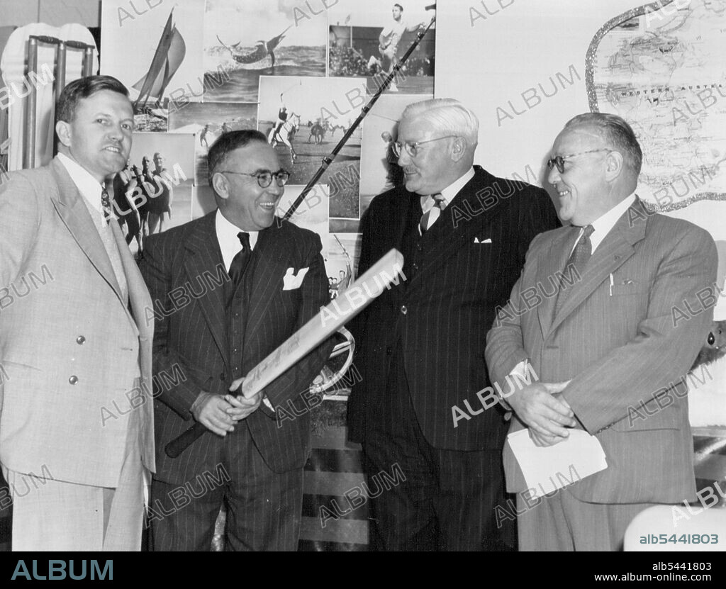 Left to Right. Mr. Paul Davies, Assistant Trace Commissioner to San Francisco. Sir Frank Beaurepaire ... The Aust. Consul-General for San Francisco, Lt.Gen. E.K. Smart, and Sir Frank Beaurepaire's associate, Mr. Armstron. World Trade Week celebrated in San Francisco recently, was the occasion for many countries to exhibit trade samples and posters, and some even had pretty girls in native costume in attendance to answer the many questions put to them by the record crowds. The Australian Trade representatives in San Francisco were responsible for the excellent Australian display which, while not very elaborate due to the shortage of dollars, attracted many people interested in the land "down under." However, among the more prominent visitors to the display was Sir Frank Beaurepaire - the famous Australian athlete ana swimmer, who is passing through America on his way to the Olympic Games in London. June 16, 1948.