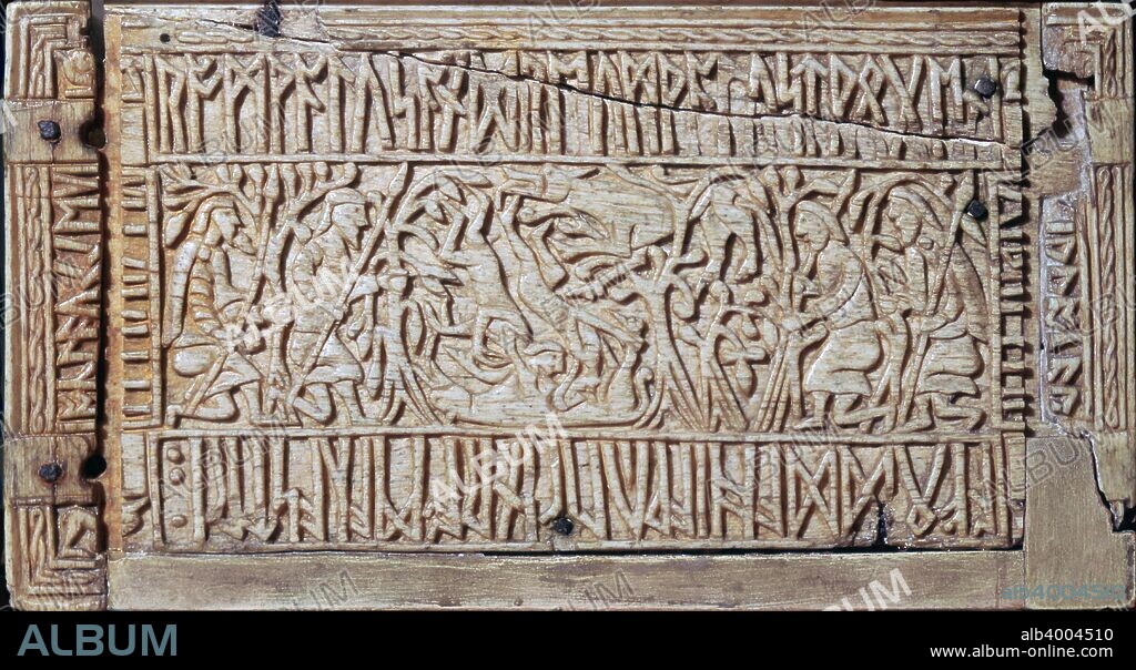 Side panel from The Franks Casket, Anglo-Saxon, first half of the 8th century. Left-hand end depicting Romulus and Remus nurtured by the wolf with an inscription describing the scene. Box also known as the Auzon casket, made from the bone of a beached whale, richly carved on the sides and lid in high relief with a range of scenes. From the British Museum's collection.