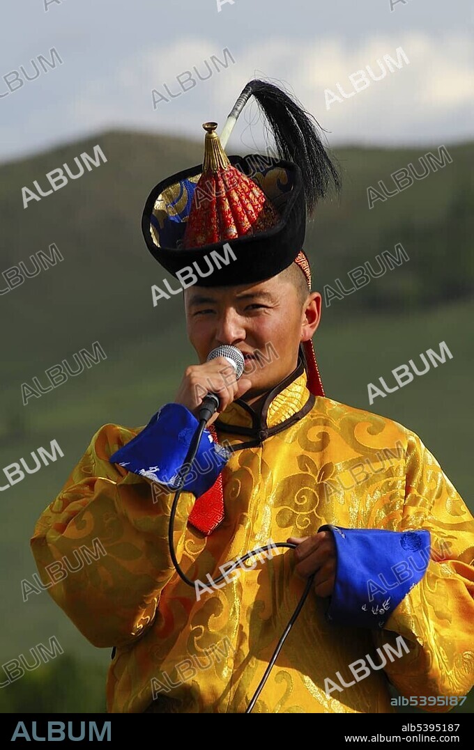 Singer wearing traditional Mongolian national costume during the Naadam Festival, Ulan Bator or Ulaanbaatar, Mongolia, Asia.
