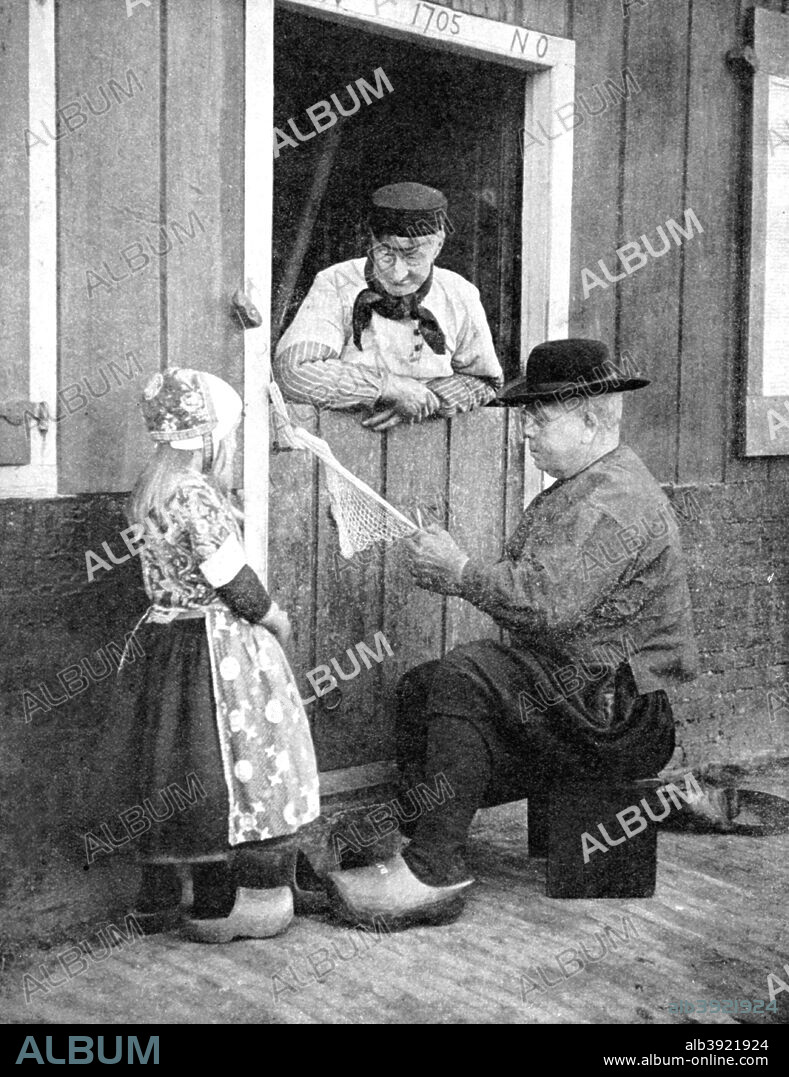 Dutch people wearing clogs, Marken, Holland, 1936. From Peoples of the World in Pictures, edited by Harold Wheeler, published by Odhams Press Ltd (London, 1936).