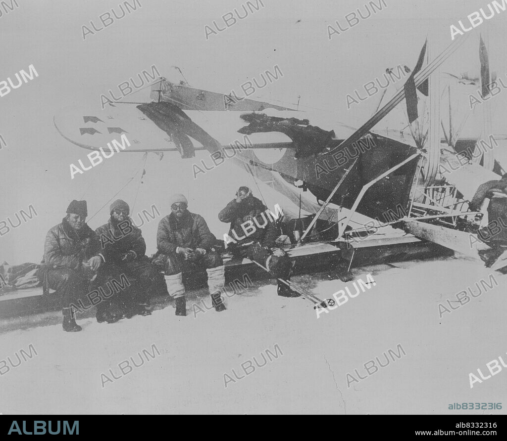 The Nobile Crew In Their Famous Red Tent! -- The most isolated people in the world - the survivors of the Nobile disaster, living in the red tent on the ice-floe. Left to right: Professor Behounek, Biagi, Viglieri, and the injured Cecioni, on the extreme right. July 31, 1928. (Photo by Pacific & Atlantic Photos).