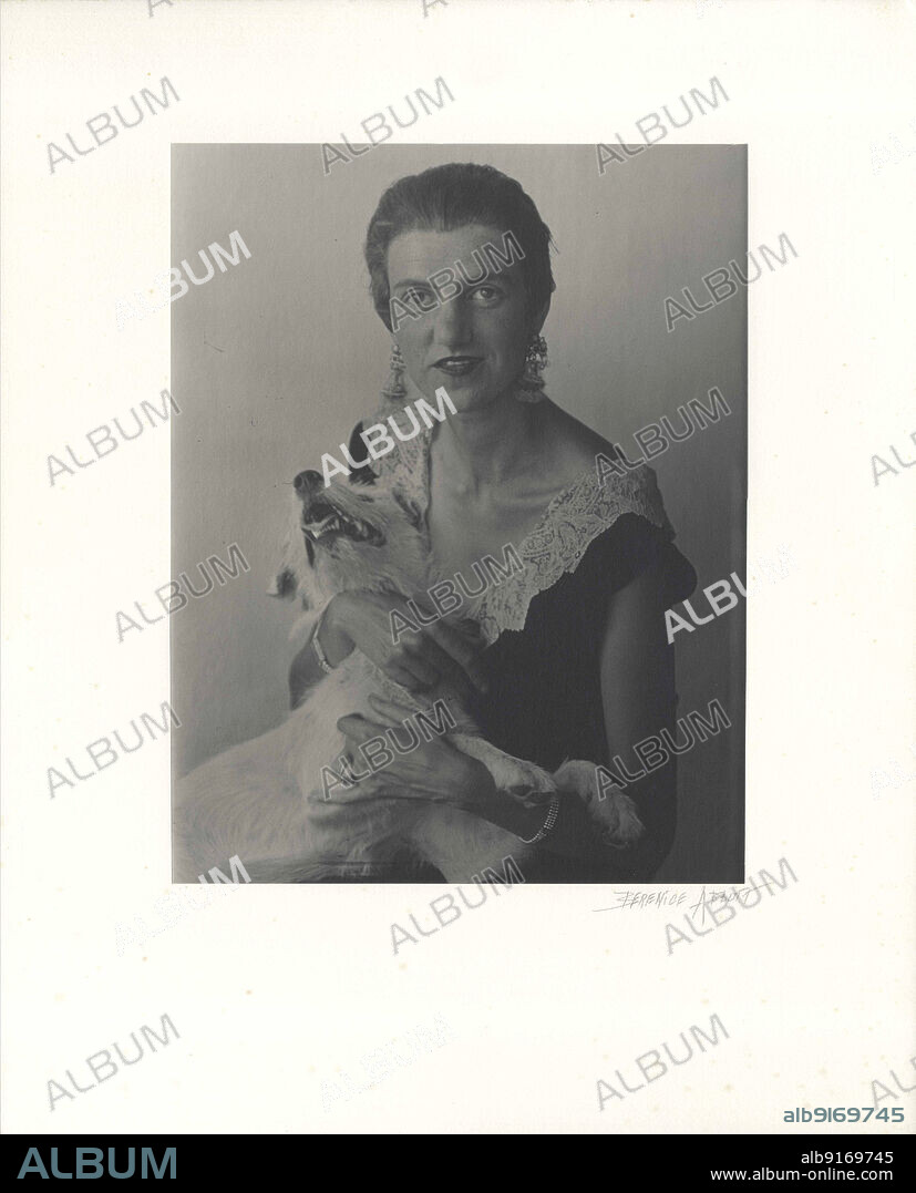 BERENICE ABBOTT. Peggy Guggenheim with one of her dogs.