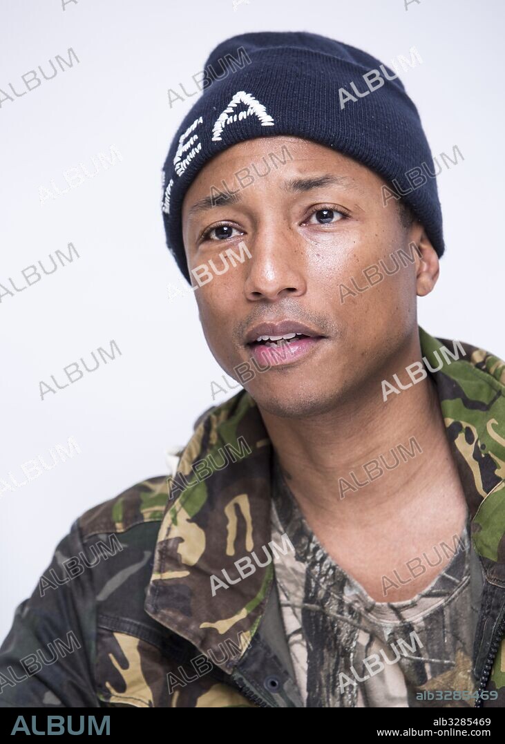 November 1, 2016 - Hollywood, California, U.S. - Musician PHARRELL WILLIAMS writer of the title song and Producer of the movie 'Hidden Figures.' Pharrell Lanscilo Williams (born April 5, 1973) is an American singer-songwriter, rapper, and record producer. Williams and Chad Hugo make up the record production duo the Neptunes, producing soul, hip hop and R&B music. He is the lead vocalist and drummer of the rock-funk-hip hop band NERFD, that he formed with Hugo and childhood friend, Shay Haley. He released his first single, 'Frontin', in 2003 and followed up with his debut solo album, In My Mind in 2006.[2] His second album, Girl, was released on March 3, 2014. This album was preceded by the commercially successful single, 'Happy'. As part of the Neptunes, Williams has produced numerous hit singles for various recording artists. Williams owns a media venture that encompasses entertainment, music, fashion, and art called i am OTHER, a multimedia creative collective and record label that serves as an umbrella for all of Pharrell Williams' endeavors, including Billionaire Boys Club. Williams has earned ten Grammy Awards including two with the Neptunes. 01/11/2016