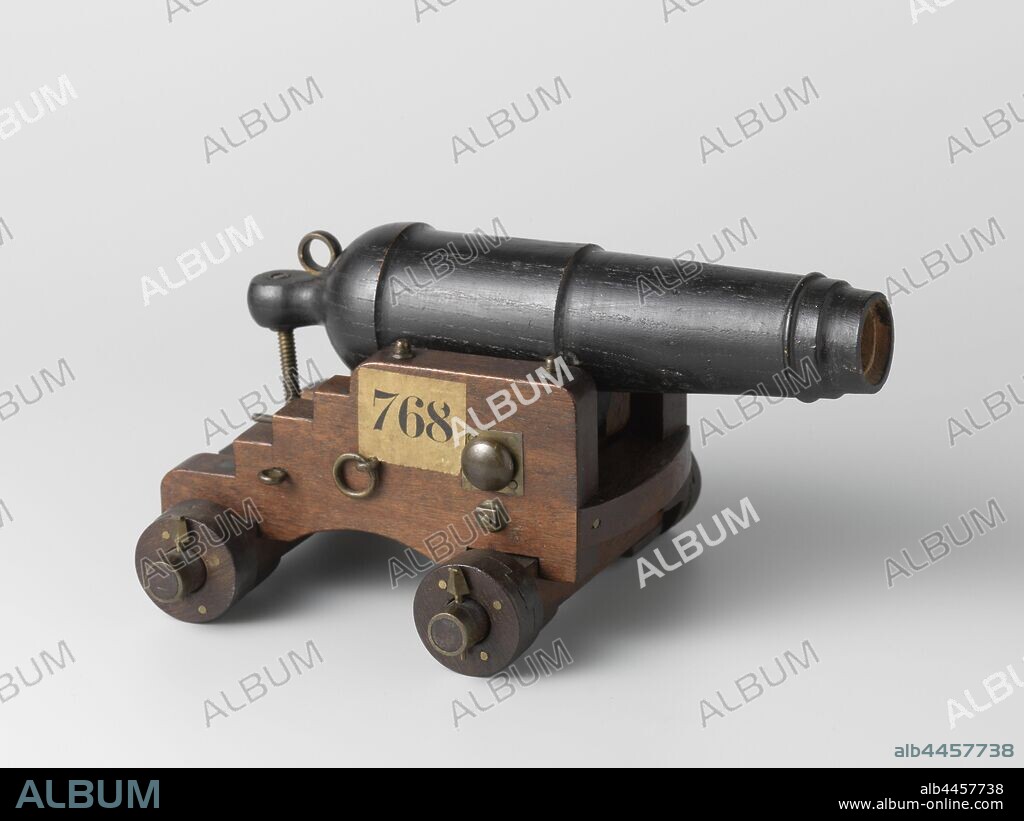 Model of a Carronade on a Sea Carriage, Model of a carronade on a horse. The 20.8 cm long wooden barrel is painted black and has a caliber of 18 mm, a copper brittle ring and a set screw through the grape. The horse's cheeks, with stairs and an elliptical cut-out at the bottom, are further apart at the back than the front and are connected by the calf and the ashes, and a breast piece. The tap runs through the cheeks, which are provided with a cushion on the inside to prevent lateral movement of the piece. The soleplate consists of a light wooden frame that connects the front and rear axle bodies. Square cushions have been placed under the ashes. The wooden wheels are double. The fittings are made of brass., Rijkswerf Vlissingen, Flushing, 1819, wood (plant material), brass (alloy), h 11.5 cm × w 22 cm × d 16 cm × h 13 cm w 35.5 cm × d 28 cm.