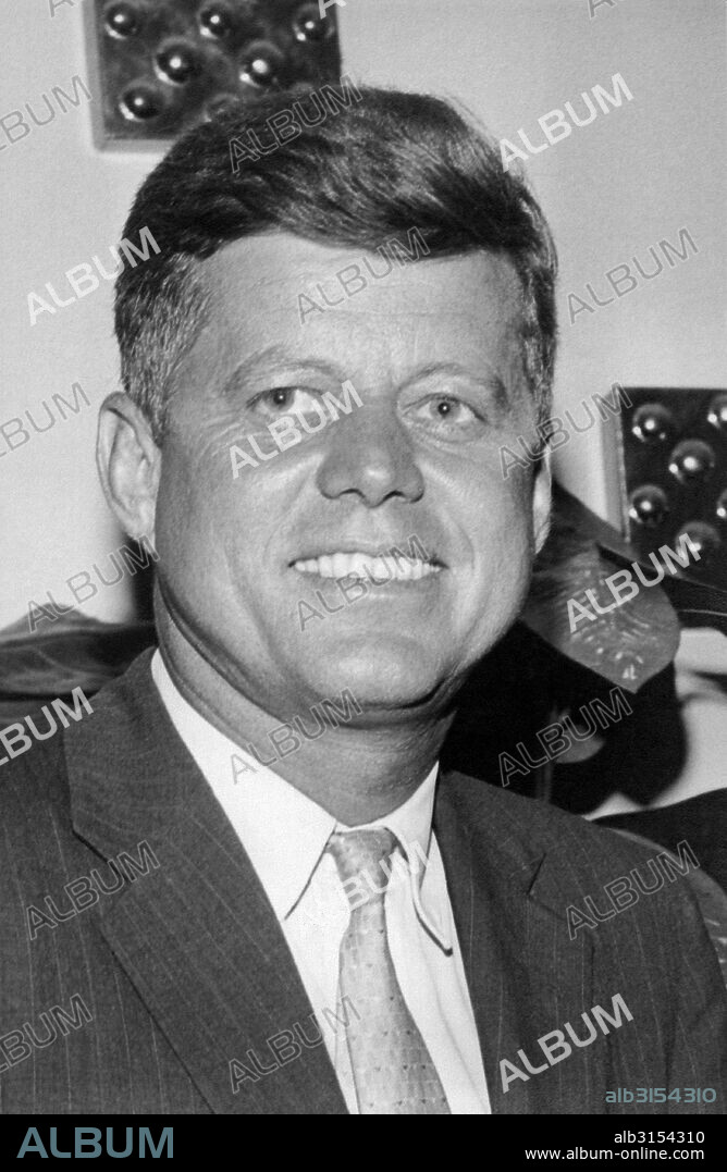 United States: c. 1960  A head and shoulders portrait shot of a smiling  John F. Kennedy.