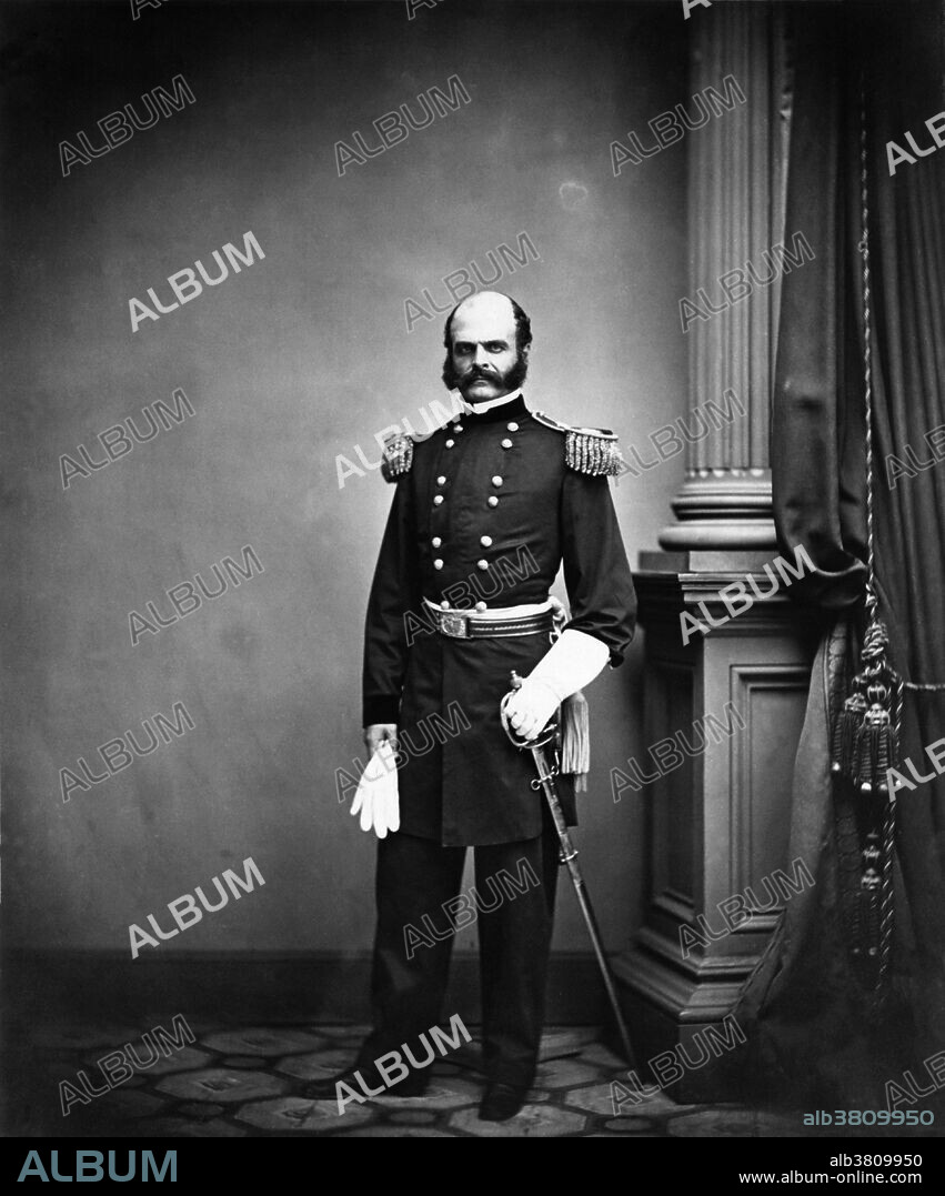 Entitled: General Ambrose E. Burnside of 1st Rhode Island Infantry Regiment and General Staff U.S. Volunteers Infantry Regiment with gauntlets and sword. Photographed by Mathew Brady. Ambrose Everett Burnside (May 23, 1824 - September 13, 1881) was an American soldier, railroad executive, inventor, industrialist, and politician from Rhode Island, serving as governor and a US Senator. As a Union Army general in the American Civil War, he conducted successful campaigns in North Carolina and East Tennessee but was defeated in the disastrous Battle of Fredericksburg and Battle of the Crater. He was always very popular both in the army and in politics. He made friends easily, smiled a lot, and remembered everyone's name. His professional military reputation, however, was less positive, and he was known for being obstinate, unimaginative, and unsuited both intellectually and emotionally for high command. He twice refused command of the Army of the Potomac, only accepting when told that the command would otherwise go to Joseph Hooker. His distinctive style of facial hair is now known as sideburns, derived from his last name. He died suddenly in 1881 at the age of 57 of neuralgia of the heart (Angina pectoris).