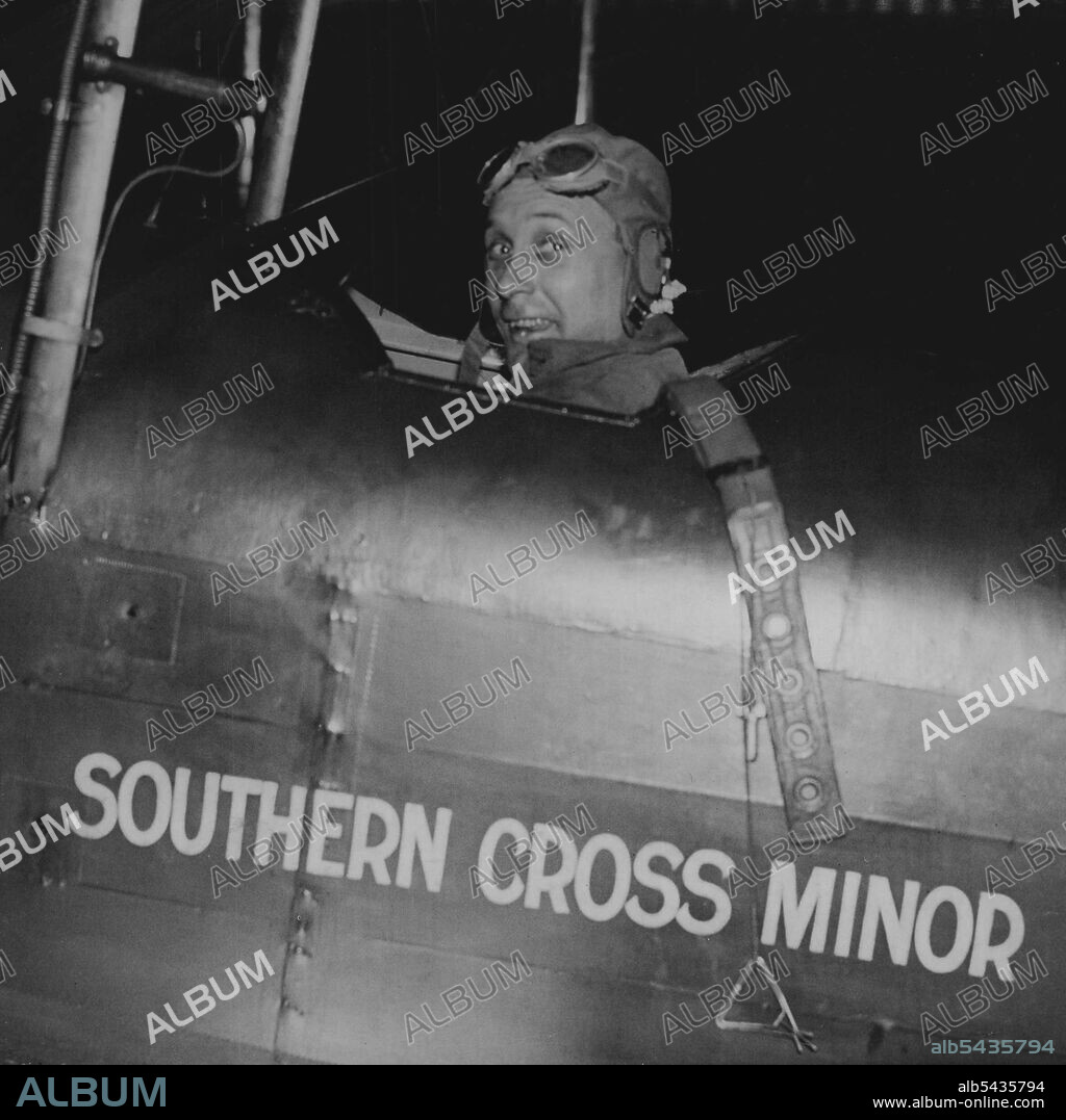 Lancaster Takes Off On Cape Flight -- Captain Lancaster in the cockpit of the Southern star junior at Lympne just before the take off at Dawn today. Flying a Southern star junior plane, Captain Lancaster left Lympne Aerodrome this morning April 11 on Hi bid to smash the Cape flight record held by Mrs. Amy Mollison. He hopes to make Oran in Algeria in one hop. His mother was present on the airfield to bid him farewell. April 11, 1933. (Photo by Associated Press Photo).