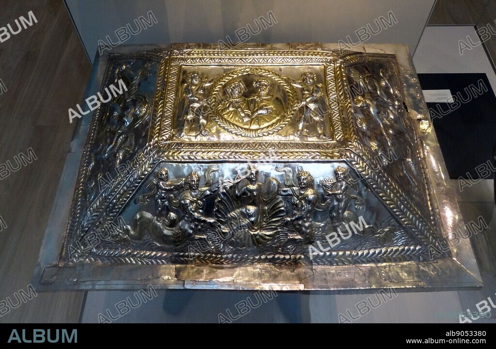 The Projecta Casket. Roman 380 AD silver casket, inscribed Secundus and Projecta, Uve in Christ in Latin, was probably a wedding gift to the couple shown on the top. On the front, the bride adoms herself while handmaids bring caskets of cosmetics.