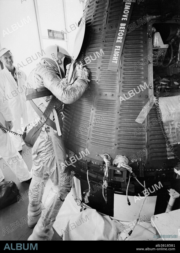 Shepard peers into his Freedom 7 Mercury capsule before launch. Mercury-Redstone 3 was the first US human spaceflight, on May 5, 1961, piloted by astronaut Alan Shepard. It was the first manned flight of Project Mercury, the objective of which was to put an astronaut into orbit around the Earth and return him safely. His mission was a 15-minute suborbital flight with the primary objective of demonstrating his ability to withstand the high g forces of launch and atmospheric re-entry. He named his space capsule Freedom 7, setting a precedent for the remaining six Mercury astronauts naming their spacecraft. His spacecraft reached an altitude of 101.2 nautical miles and traveled a downrange distance of 263.1 nautical miles. During the flight, Shepard observed the Earth and tested the capsule's attitude control system, turning the capsule around to face its blunt heat shield forward for atmospheric re-entry. After re-entry, the capsule landed by parachute on the Atlantic ocean off the Bahamas. Shepard and the capsule were picked up by helicopter and brought to an aircraft carrier.