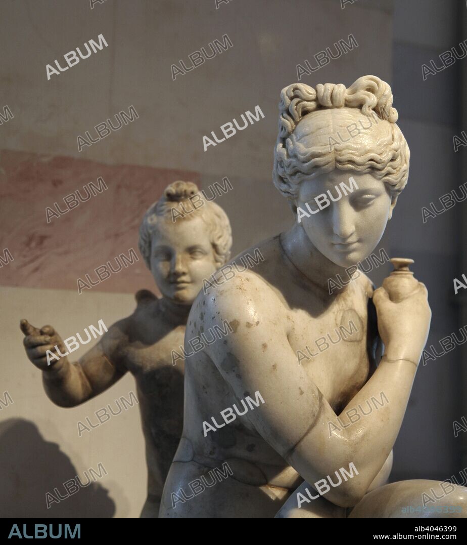 Statue of bathing Aphrodite and Eros. Roman, after a Greek original of the second half of the 3rd century BC. In Greek mythology, Aphrodite was the Goddess of Love and Beauty and Eros was her son. Their equivalents in the Roman pantheon are Venus and Cupid. Found in the collection of The Hermitage, St Petersburg.