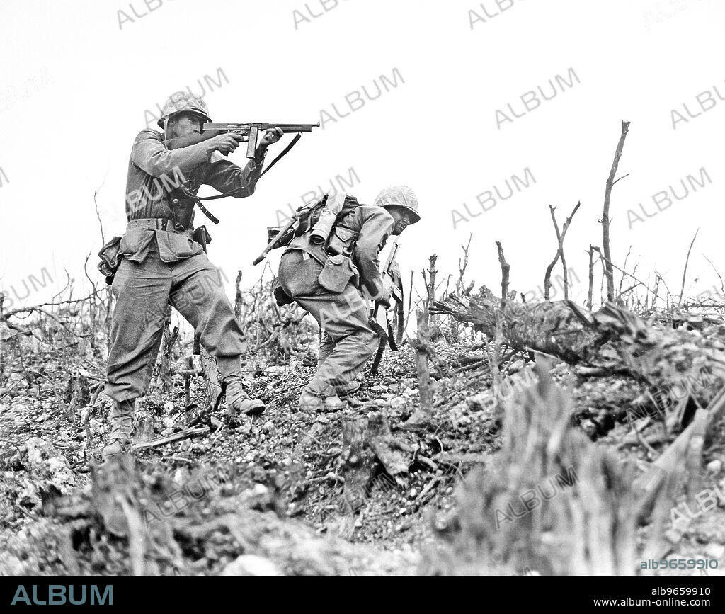 Two Marines from the 2nd Battalion, 1st Marine Regiment, Davis Hargraves and Gabriel Chavarria, during fighting at Wana Ridge during the Battle of Okinawa, U.S. Department of Defense, U.S. Marine Corps photo, May 1945.