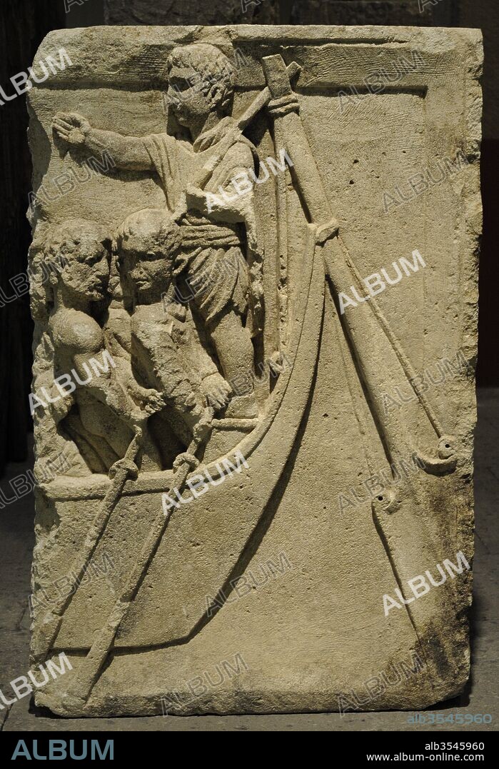 Fragmento de un relieve funerario con la representación de la popa de un barco con el timonel y los remeros, que por su aspecto parece tratarse de bárbaros. Finales del siglo I. Procedente de Colonia, Alemania. Museo Romano-Germánico. Colonia. Alemania.