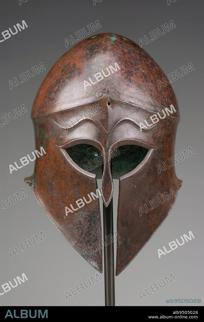 Corinthian helmet, c. 540 BCE, Unknown Greek, 11-13/16 x 7-7/8 x 10-1/2 in. (30.0 x 20.0 x 26.7 cm), Bronze, Greece, 6th-5th century BCE, This magnificent bronze helmet is an exceptional example of Corinthian personal armor. It is skillfully beaten from a single sheet of bronze. Developed in the early 600's BCE, the 'Corinthian style' helmet had no ear holes, but had a cap-shaped crown, solid nose guard, and flared cheek pieces. For display and further protection, a horsehair crest would have been attached to the top of the crown ridge. Small holes pierced along this ridge would have been used to secure the missing crest. Away from combat, the helmet could be pushed up to rest above the face. A typical set of Greek armor from this period also included a bronze breastplate and metal shin guards called greaves. The pure abstract form, simple curvilinear eyebrows, and restrained floral décor make this an especially beautiful, utilitarian object.
