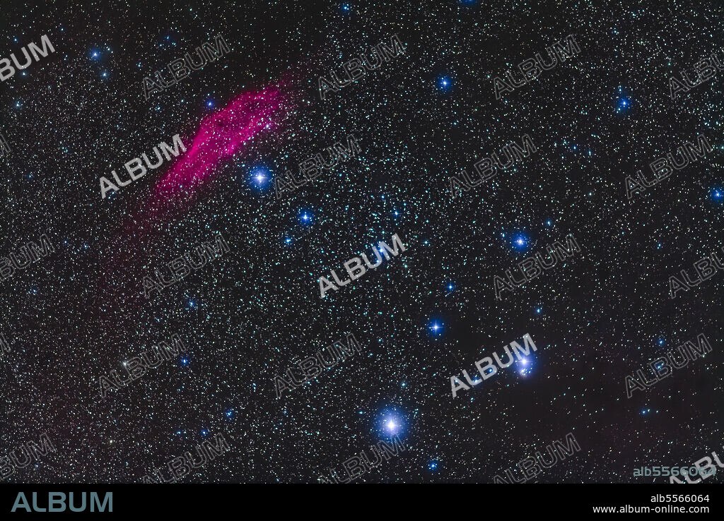 The California Nebula, NGC 1499, at top left, with the bright star Zeta Persei. at bottom. A faint region of reflection nebulosity, IC 348, surrounds the star Atik, or Omicron Persei, at bottom right. The star just below NGC 1499 is Menkib, or Xi Persei.