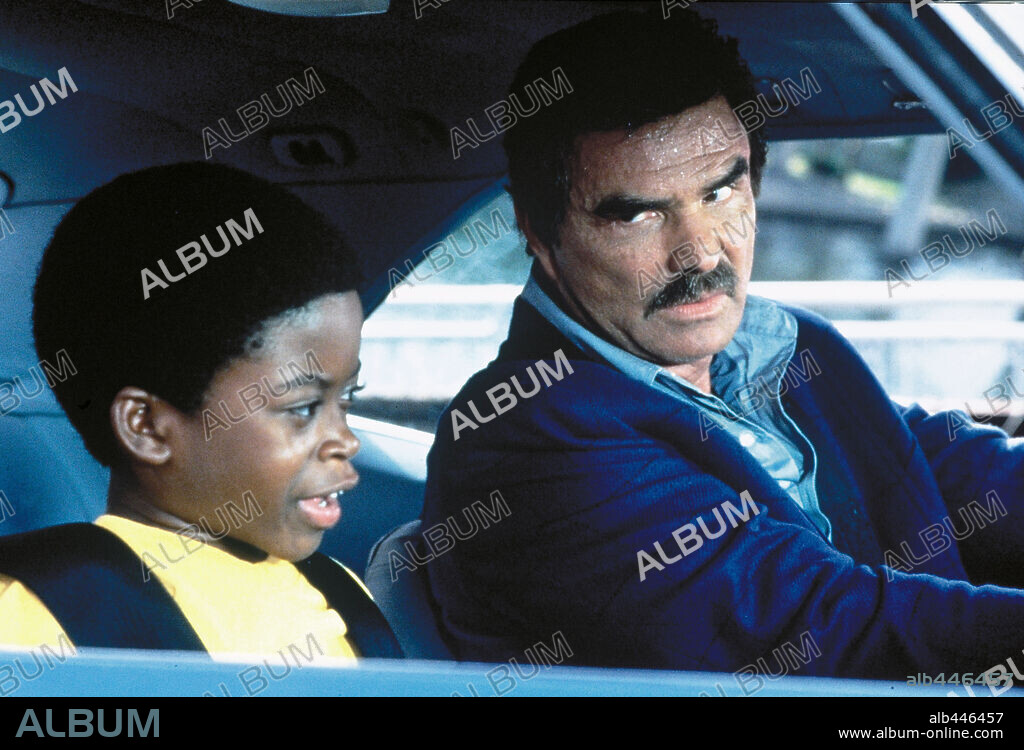 BURT REYNOLDS and NORMAN D. GOLDEN II in COP AND A HALF, 1993, directed by HENRY WINKLER. Copyright UNIVERSAL PICTURES.