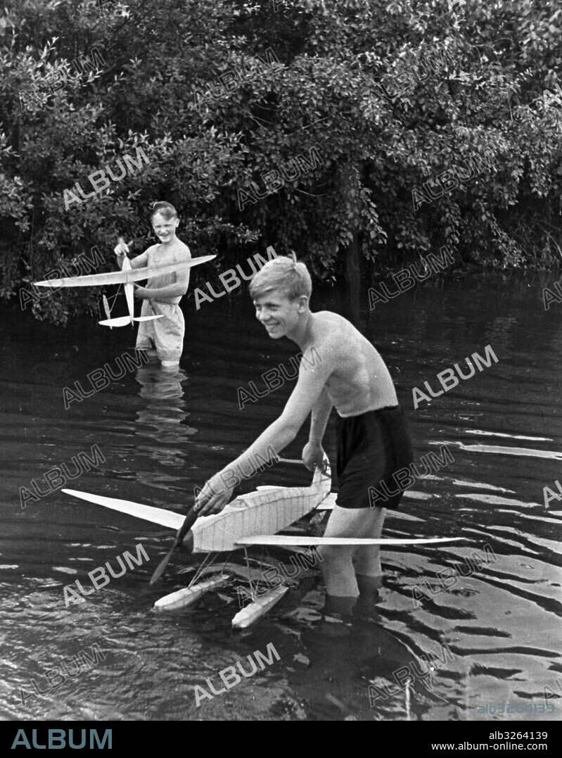 The 4th Conference of young Moscow masters of airplane modelling at the station 'Planernaya'. A participant with his sea-plane model. July 1938.