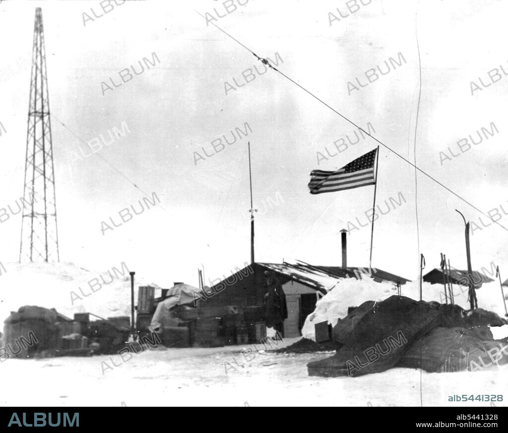 "Old Glory" Goes South" - The Stars and stripes wave over the Headquarters of the Byrd expedition in little America where the party will spend the Antarctic winter. May 19, 1929.