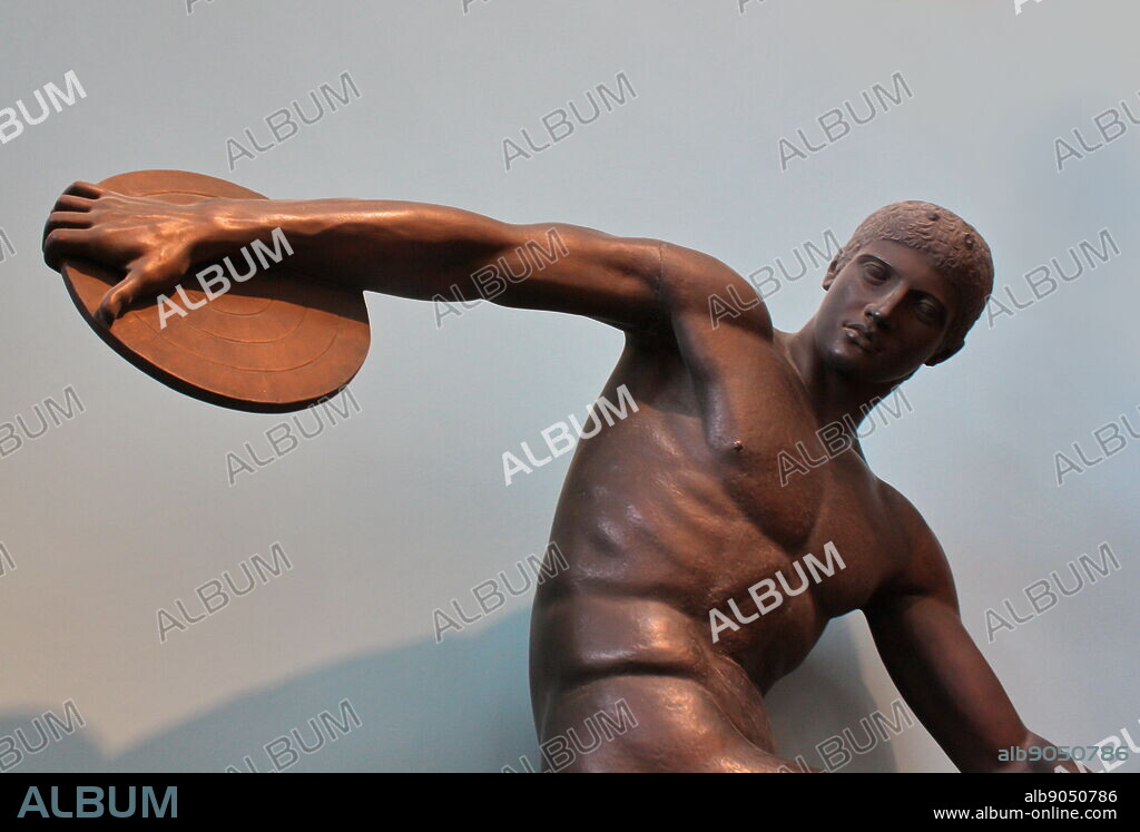 Diskobolos (discus-thrower) of Myron. An athlete is coiled up in a taut, memontary pose, about to throw the discus - one of the pentathlete's five events. The cast combines a headless statue from Hadrian's Villa at Tivoli and the head of a statue found in Rome. Copied closely from a lost bronze victor statue by the Athenian sculptor, Myron, active c 460-440 BC.