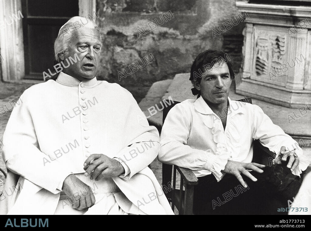 Curd Jurgens and Bekim Fehmiu. A dialogue between actors Curd Jurgen and Bekim Fehmiu in a scene from the movie 'Cagliostro-Im Schatten des Todes'. Rome (Italy), 1975.