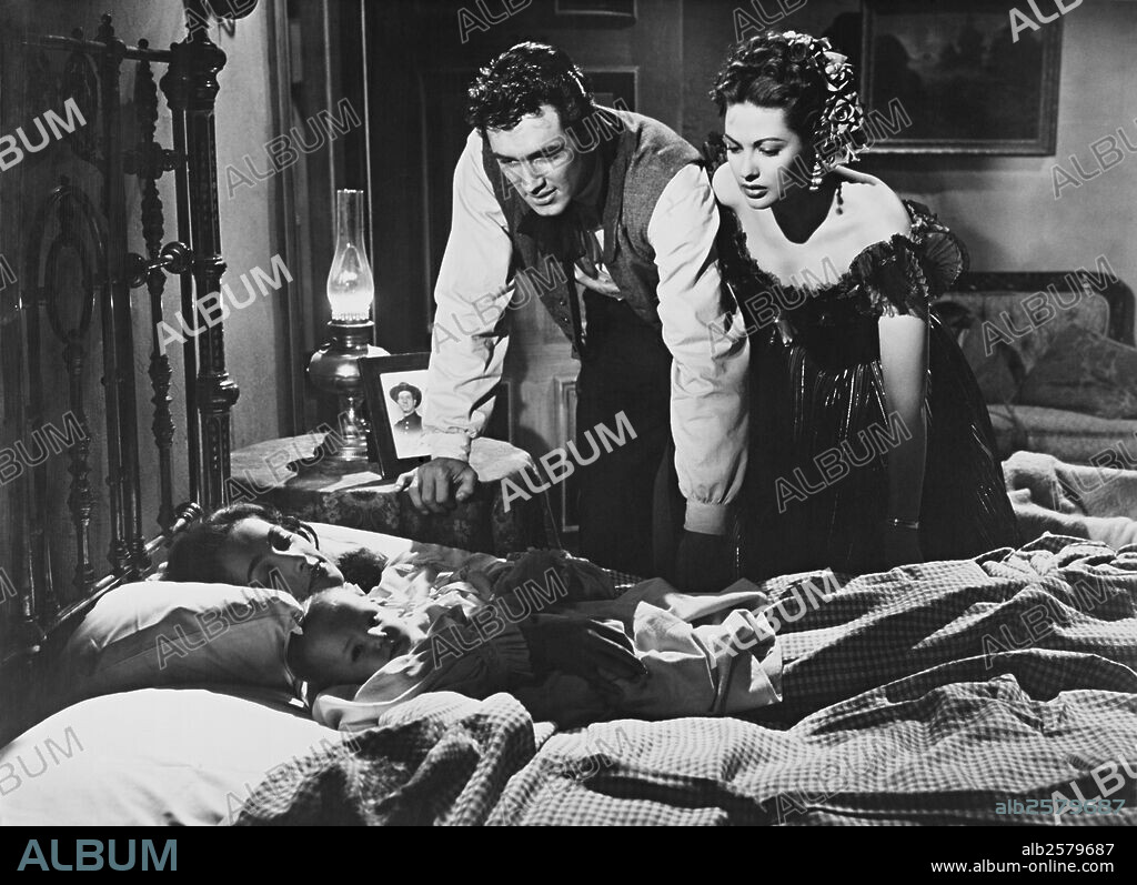 ROCK HUDSON and YVONNE DE CARLO in SCARLET ANGEL, 1952, directed by SIDNEY SALKOW. Copyright UNIVERSAL PICTURES.