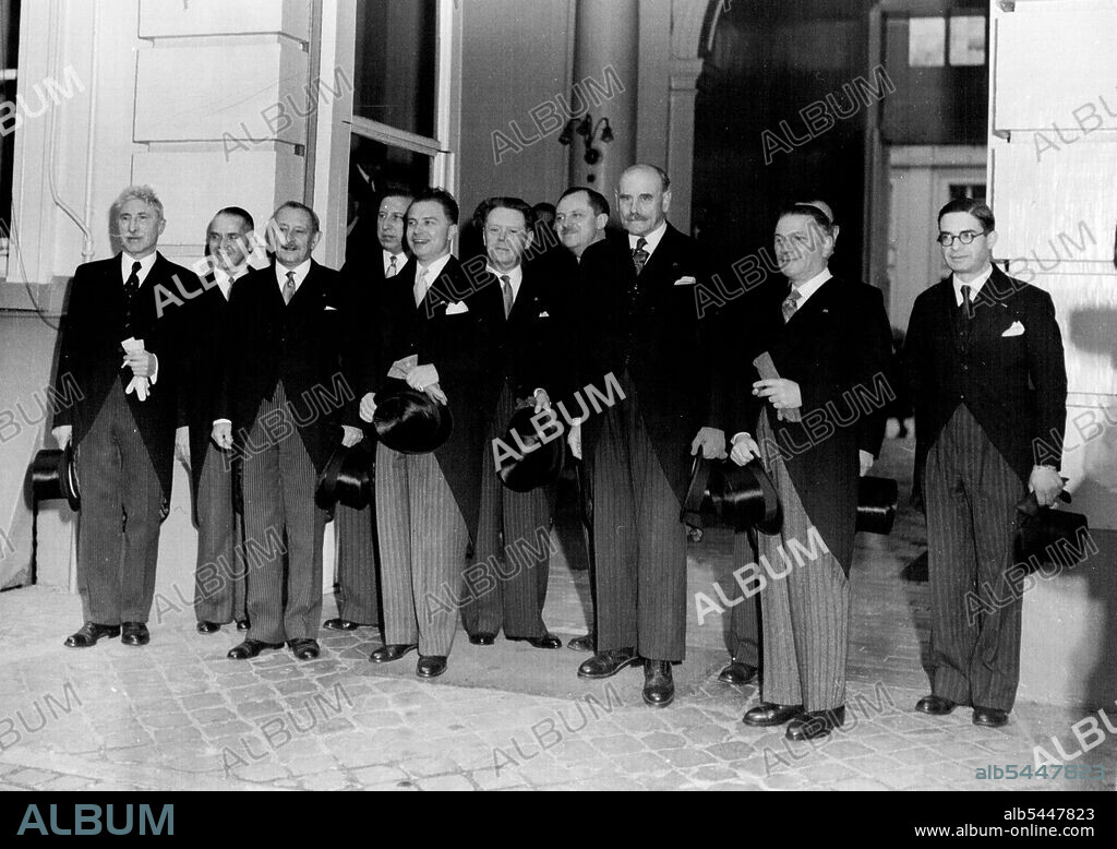 Belgium Gets a New Government -- Brussels -- Belgium's new Cabinet, headed by M. Gaston Eyskens (Social Christian), being received by the Prince Regent of Belgium. Left to right - M. Octave Dierckx (Liberal: Minister of State without Portfolio): M. Adolphe Van Glabbeke (Liberal: Minister of Health): M. Albert Deveze (Liberal: National Defence and Deputy Premier): M. P.W. Segers (Social Christian: Communications): M. Gaston Eyskens: M. Albert de Vleeschauwer (Social Christian: Interior): M. Albert Lilar (Liberal: Justice): Count Henri. Carton de Wiart (Social Christian: Minister without Portfolio): M. Leo Mundeleer (Liberal: Education): M. Jean Rey (Liberal: Reconstruction). The new Coalition - formed-after M. Spaak's government resigned on June 27 - was formed without the Socialists. August 11, 1949.