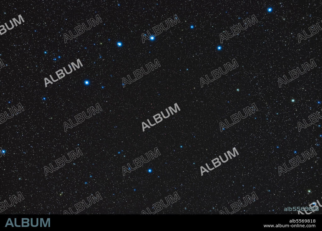 The majority of the northern spring constellation of Canes Venatici, the Hunting Dogs, below the handle of the Big Dipper. The southernmost area of CVn is missing here to frame the handle of the Dipper at top for context. At centre is the very red carbon star, Y CVn, aka La Superba. The bright star at bottom is Alpha Canum Venaticorum, or Cor Caroli, a bright double star. The galaxies M51 and M106 in CVn and M101 in UMa are just barely visible.