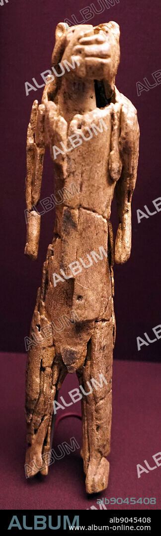 Carved mammoth ivory in the shape of a lion-man figure from Germany. Dated 50th Century BC.